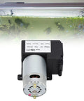 Micro Dc Vacuum Pump Air Trap Device With Killer Suction Low Noise Heavy Duty Shop Grade Workhorse That Is Solid As A Rock Premium Plastic Shell Stable Flow Control For Industrial Pipeline Workshop Projects Dc12V installed with aquarium background showing fish.