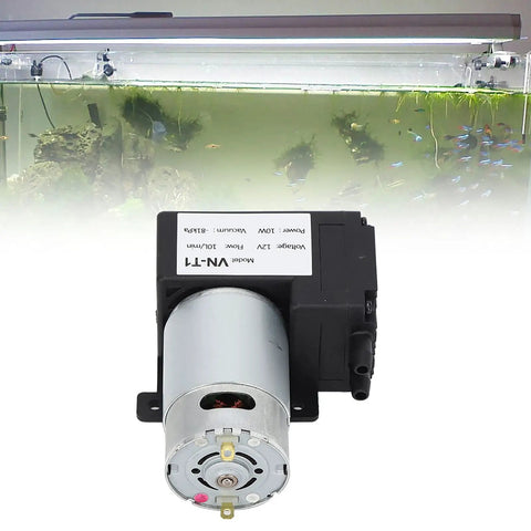 Micro Dc Vacuum Pump Air Trap Device With Killer Suction Low Noise Heavy Duty Shop Grade Workhorse That Is Solid As A Rock Premium Plastic Shell Stable Flow Control For Industrial Pipeline Workshop Projects Dc12V installed with aquarium background showing fish.