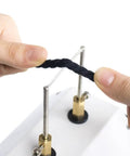 Using the 30W Compact Electric Hot Tool Quick Heating Seam Smoother on a black cord for effortless sealing.
