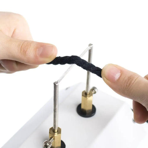Using the 30W Compact Electric Hot Tool Quick Heating Seam Smoother on a black cord for effortless sealing.