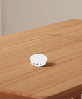 White Round Screw Hole Caps Plugs With Snap In Locking Cover For Cabinets And Displays on wooden surface, 50mm Flush Type Matte Finish