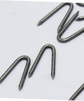 Close-up of U Shaped Garden Stakes And Fixing Nails Set For Fences And Ground Anchors Pro Grade 100 Piece U Nails for Easy Garden Projects