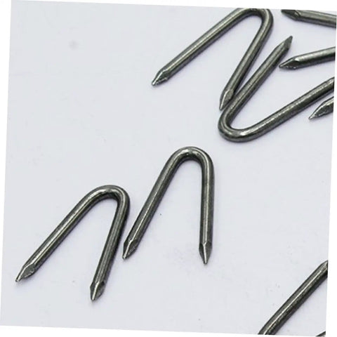 Close-up of U Shaped Garden Stakes And Fixing Nails Set For Fences And Ground Anchors Pro Grade 100 Piece U Nails for Easy Garden Projects