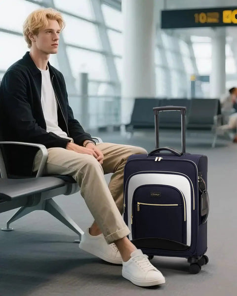 Flight Ready Carry On Luggage 22x14x9 Inches Airline Approved Softside 20 Inch Spinner Wheels With TSA Lock next to traveler at airport