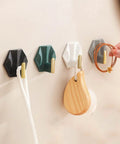 Sleek Adhesive Wall Hooks 4 Pack With Super Tough Grip Tape for organizing jackets and bags on a wall.