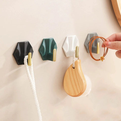 Four Piece Adhesive Wall Coat Hooks Ditch The Clutter And Keep Your Entryway Slick With No Drill Setup for various accessories on wall.