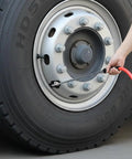 Person using Smooth Operator Truck Tire Inflator Kit Featuring 50 Foot Extended Air Hose And 200 Psi Universal Gladhand Connection to inflate truck tire.