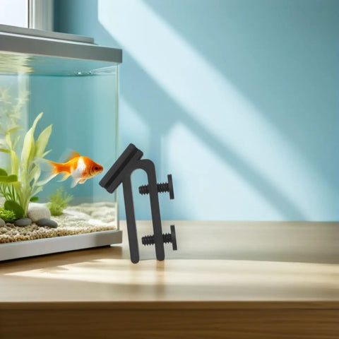 Fish Tank Water Hose Clip Holder Made Of ABS Plastic next to aquarium