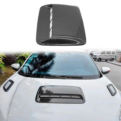 Kickass Faux Hood Vent Scoop For Tesla Cybertruck Featuring High Gloss Carbon Fiber Trim on white vehicle hood