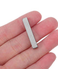 Person holding one piece of 20 Pieces Parallel Drive Shaft Keys Set, Pro Grade Stainless Steel Keyways For Secure Fastening, 3 x 0.5 cm