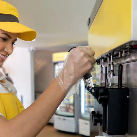 Person using Ice Cream Maker Lever Handle Replacement For Home Machines With Adjustable Control in a shop setting.
