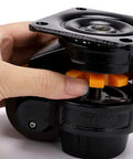 Beefy Heavy Duty Leveling Casters With Large Top Plate And Retractable NBR Pad being adjusted by hand for secure placement.