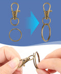 Heavy Duty Swivel Lobster Claw Keychain Clasps And 50 Piece One Inch Zinc Alloy Snap Hooks For Crafts Jewelry Making Dang Sturdy Bag Charms In Top Tier Bronze Finish, featuring a hand demonstrating attachment.