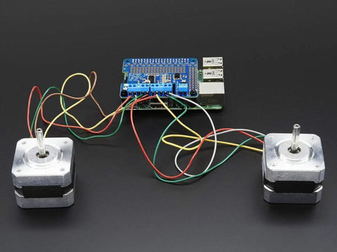 DC And Stepper Motor HAT For Raspberry Pi Mini Kit with two connected stepper motors, featuring TB6612 H-bridges and colorful wires