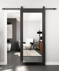 36 Inch Wide By 84 Inch Tall Mirror Barn Door Built Tough With 6.6 Foot Sliding Hardware Kit Included One Lite Full Length Glass Solid Wood Waterproof PVC Surface Scratch Resistant No Assembly Required Black, installed in a modern bathroom.