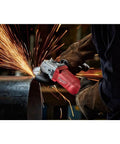 Heavy Duty Corded Angle Grinder 120 Volt With Soft Grip Handle cutting steel with sparks flying in workshop setting.