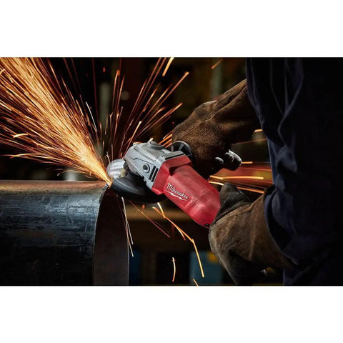 Heavy Duty Corded Angle Grinder 120 Volt With Soft Grip Handle cutting steel with sparks flying in workshop setting.