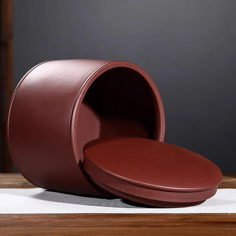 Heavy Hitter Ceramic Rice Jar Round With No Sweat Seal, Retro Large Capacity Airtight Grain Bucket, Real Deal Pantry Storage For Tea Coffee Beans And Snack Stash, High Fire Kiln Made shown on wooden surface with lid beside.