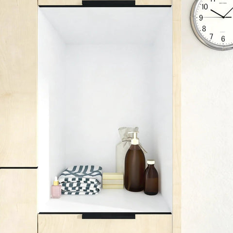 White Contact Paper Peel And Stick Wallpaper for Cabinets and Walls lining a wooden shelf with bottles and towels.
