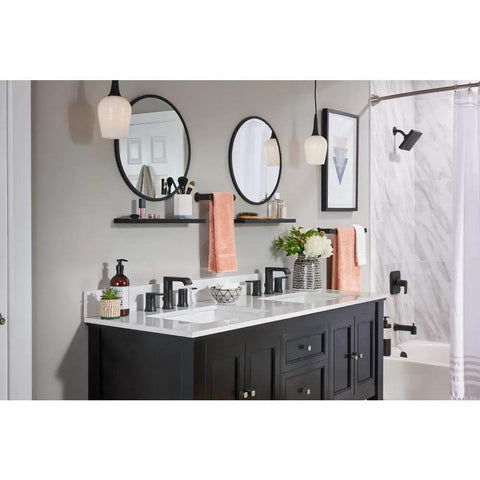 Modern bathroom with Genta 8-Inch Widespread Two-Handle Bathroom Faucet in Matte Black, large mirror, and decor accents.