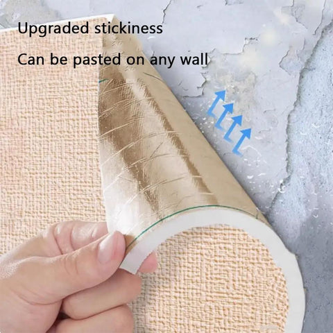 Hand removing Stress Free Peel And Stick Wallpaper Roll showing soft pink concrete texture and adhesive backing.