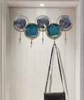 Wall Mounted Coat Rack With Heavy Duty Iron Hooks For Entryway Or Bathroom Door Organizer with decorative hooks and a bag.