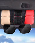 Premium Microfiber Leather Magnetic Sunglasses Holder For Car Sun Visor With Strong Grip And Sleek Black Finish holding sunglasses.