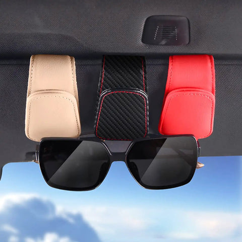 Premium Microfiber Leather Magnetic Sunglasses Holder For Car Sun Visor With Strong Grip And Sleek Black Finish holding sunglasses.