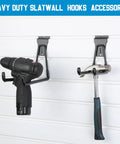 Drill and hammer on 36 Piece Slatwall Hooks And Hangers Set With Heavy Duty Slat Wall Hooks And 4 Storage Straps for garage wall organization.