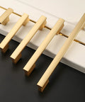 Ten Pack Brushed Gold Cabinet Knobs 2 Inch 50mm Single Hole Pulls For Kitchen Cabinets And Drawer Fronts ZH0026 shown in different sizes