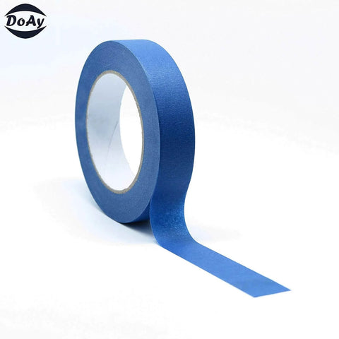 Side view of a roll of blue painter tape showing crepe paper texture, from the Blue Painter Tape Set With 1/4 In, 1/2 In, 3/4 In Widths For Pro Grade Precision On Walls, Trim And More Across Multiple Surfaces, 60 Yards Total Across 3 Easy Tear Crepe Paper Rolls.