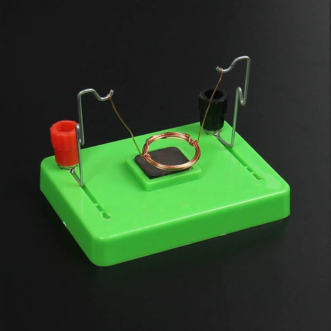 Electric Motor Model And Electromagnetic Swing Kit For Classroom Learning on green base with coiled wire and terminals