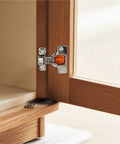 Concealed Soft Close Cabinet Hinges Featuring Short Throw Arms And Hydraulic Damping For Tight Furniture Frames Buttery Smooth Closure Zero Drama Black Pair Heavy Duty Hardware installed on wood cabinet.
