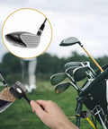 Two Pack Golf Club Brush With Magnetic Keychain And Oversized Cleaning Head being used on a golf club head in a golf bag