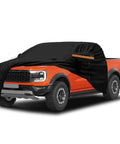 Kistrba cab car cover for mid-size crew-cab pickup, black fabric over orange truck