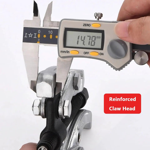 Close-up of Professional Workhorse Two Jaw Adjustable Gear Puller And Bearing Removal Tool being measured with caliper.