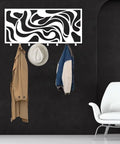 Sleek Abstract Wall Rack - Heavy Duty Modern Metal Hooks - Premium Key Holder And Coat Organizer - Crisp white design with coats and hats.