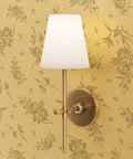 Straight Up Pink Vintage Floral Gold Metallic Wallpaper That Brings Major Style Points To Any Spot With Quick Paste Routine And Sustainable American Made Specs Type I Fire Safe Wallcovering Solid Finish with stylish wall sconce.