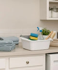 Heavy Duty White 12 Quart Plastic Dishpan Wash Tub For Soaking Feet, Laundry, Hand Washing And Storage on laundry counter