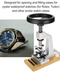 Top Tier Premium Watch Case Opener Tool Set Hella Tough Bench Press Vice next to a stylish waterproof watch on a work surface.