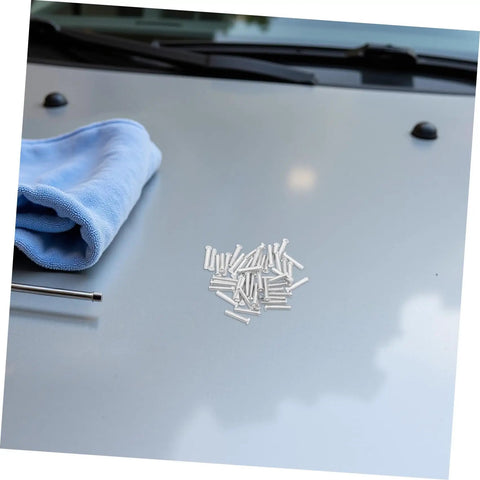 Get Those Dings Gone With These 50 Silver Metal Car Body Repair Welding Studs 4mm on a vehicle hood with a blue cloth.