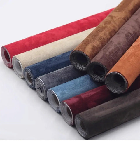 Rolls of various colored self-adhesive leather repair patches for couches, sofas, car seats, and furniture.