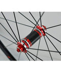 700C Road Bike Wheelset With Carbon Fiber Hubs 40mm Matte Aluminum Rim CV Brake, front 100mm quick release hub detail view.