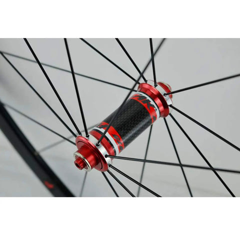 700C Road Bike Wheelset With Carbon Fiber Hubs 40mm Matte Aluminum Rim CV Brake, front 100mm quick release hub detail view.