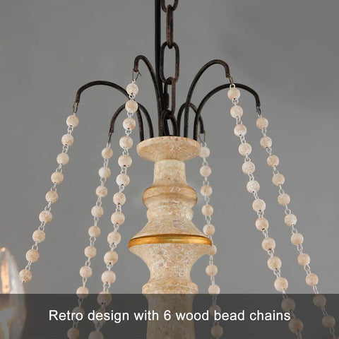 Close-up of French Country Farmhouse Six Light Chandelier With Wood Bead Accents, distressed white wood finish, elegant details