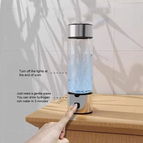Portable Hydrogen Water Bottle With 1400ppb Generator, 460ml Hydration Cup shown on wooden table with finger pressing button