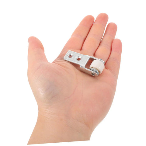 Smooth As Butter Sliding Door Roller Track Guide Wheels 6 Pack Heavy Duty Nylon Floor Protector displayed in hand.