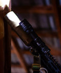 LH8 V2 Weapon Light Head Potted 5700K, 128000 CD, 1650 LM, mounted on tactical setup in dimly lit area