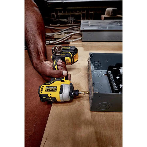Atomic 20V Max Impact Driver Kit With 1700 In-Lbs Torque in use, demonstrating precision in tight workspace with metal box.