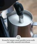 Barista Pro Espresso Machine With Built-In Grinder And 4 Keys Formula steam wand creating silky microfoam in milk jug